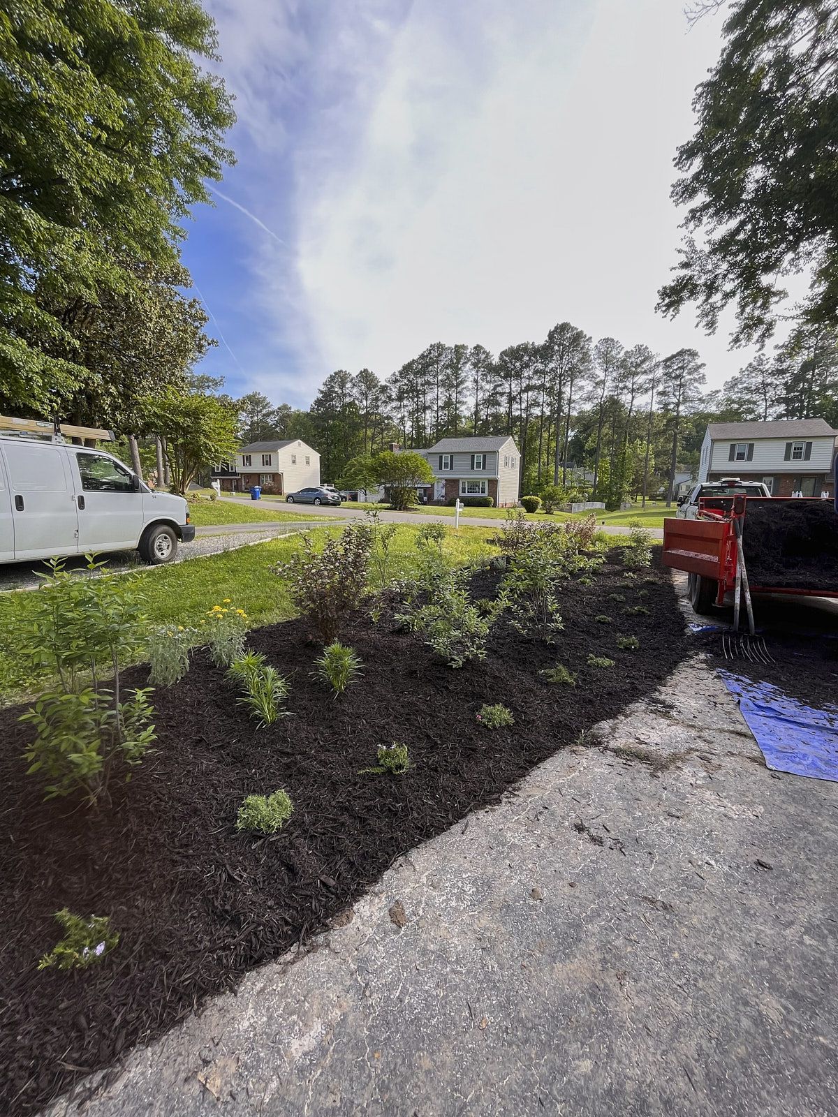 Mulch installation on a landscaped slope