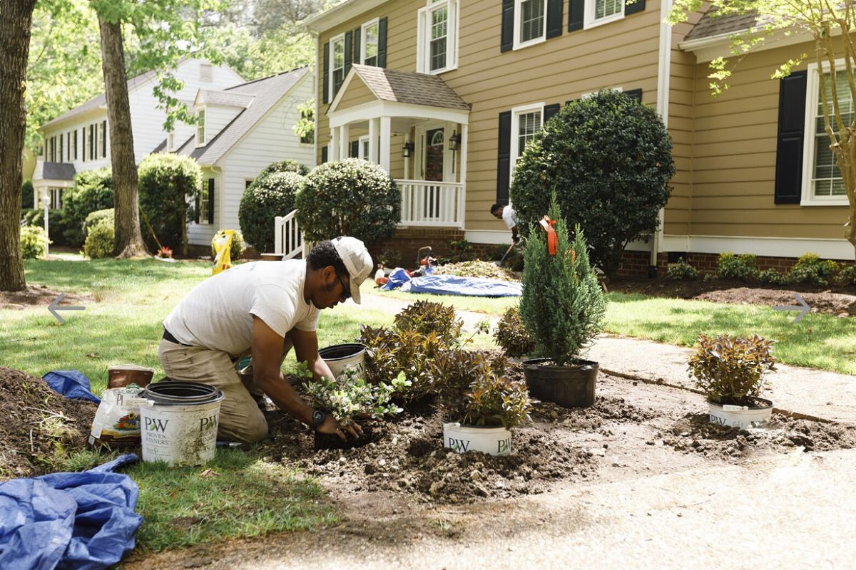 Southern Sun employee planting flowers